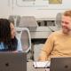Students talking at desk